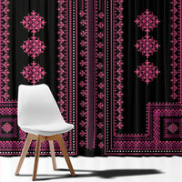 Close view of black curtain fabric with pink geometric motifs and border lines.