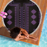 Round beach blanket laid flat, black with purple vertical pattern and white tassel fringe