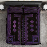Purple and black traditional geometric bedding set with embroidered-style border patterns.