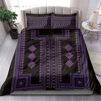 Purple geometric bedding set on a sofa bed with two coordinating pillow covers.