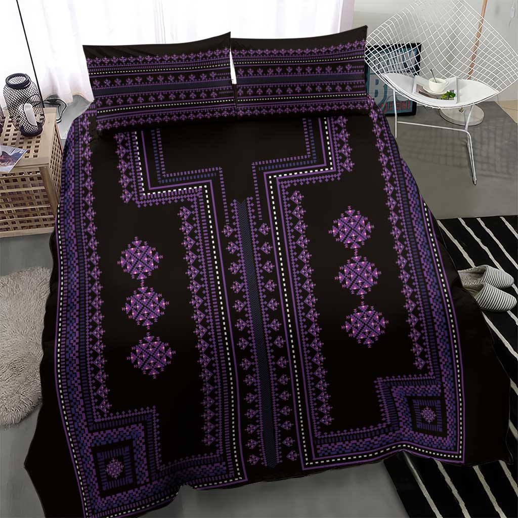 Close view of purple and black patterned duvet cover with geometric diamond motifs.