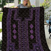 Black quilt with purple geometric pattern panels and diamond motifs, quilted stitching