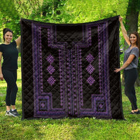 Black quilt with purple geometric border and diamond motif panels, quilted fabric