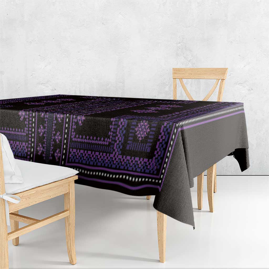 Purple traditional tablecloth with geometric motifs, border stripes, and long draped edge.