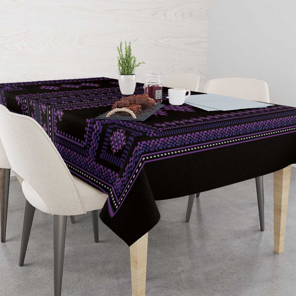 Purple and black geometric-pattern tablecloth laid on a dining table with overhang.
