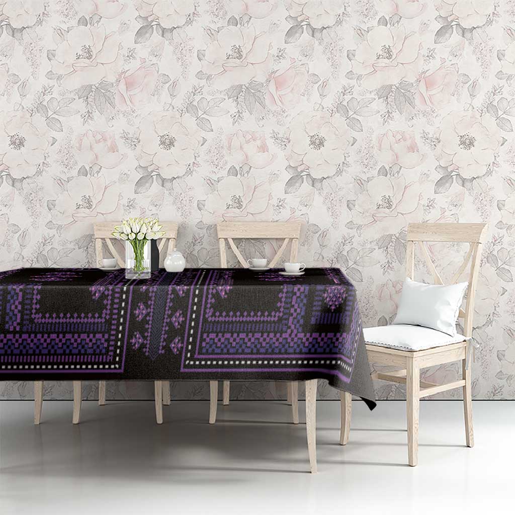 Purple and black geometric tablecloth with border design on a dining table in a room.