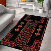 Geometric traditional area rug with black background, red-orange bands, and star motifs