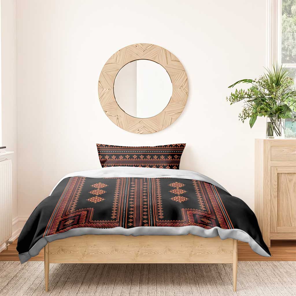 Black duvet cover with red stripe and diamond geometric pattern on bed