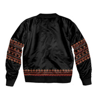 Unisex black bomber jacket back view with red-orange patterned band at hem