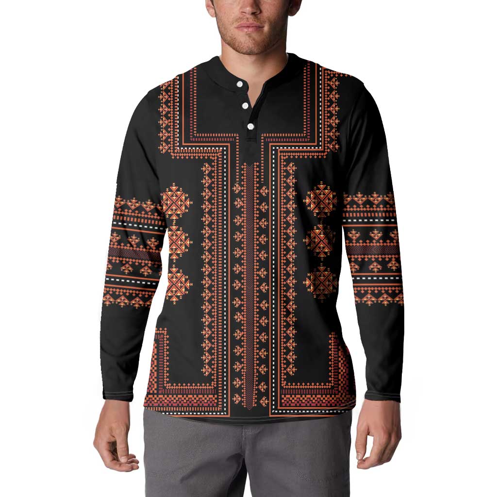 Black button-front sweatshirt with ornate red-orange border and vertical stripe design