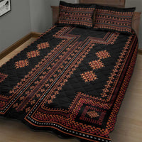 Black quilt bed set with red geometric runner stripe and diamond motifs, paired pillow shams