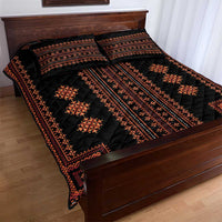 Black quilt bed set with red geometric border and central stripe, with matching pillow shams