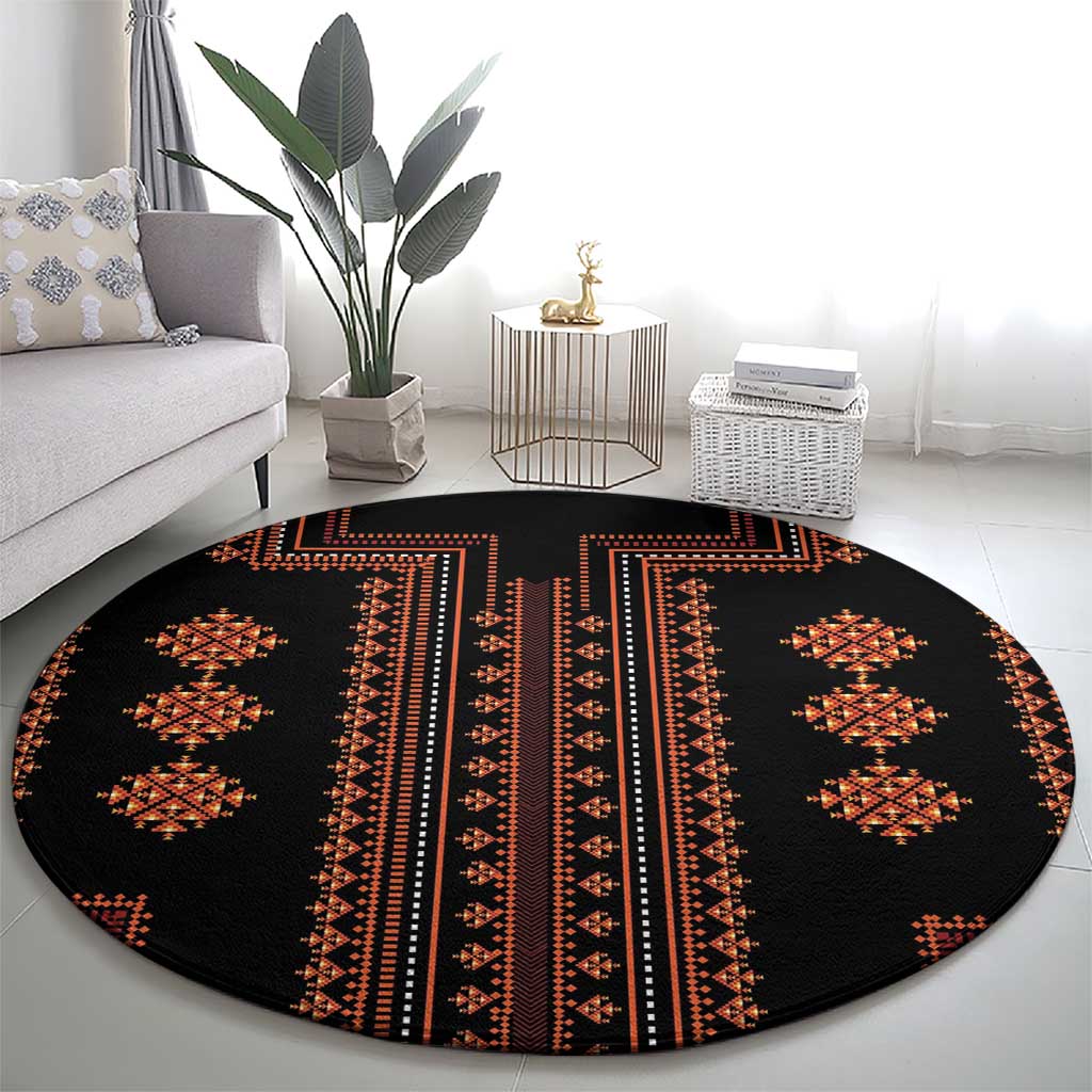 Round area rug, black with red and orange geometric center stripe