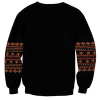 Unisex black sweatshirt with traditional red-orange sleeve patterns and ribbed collar