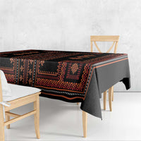 Red and black traditional patterned tablecloth, geometric border and center motifs