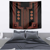 Dark tapestry wall hanging with red border trim and repeating vertical medallion shapes