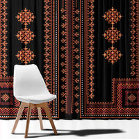 Traditional patterned window curtain with black base and red diamond motifs