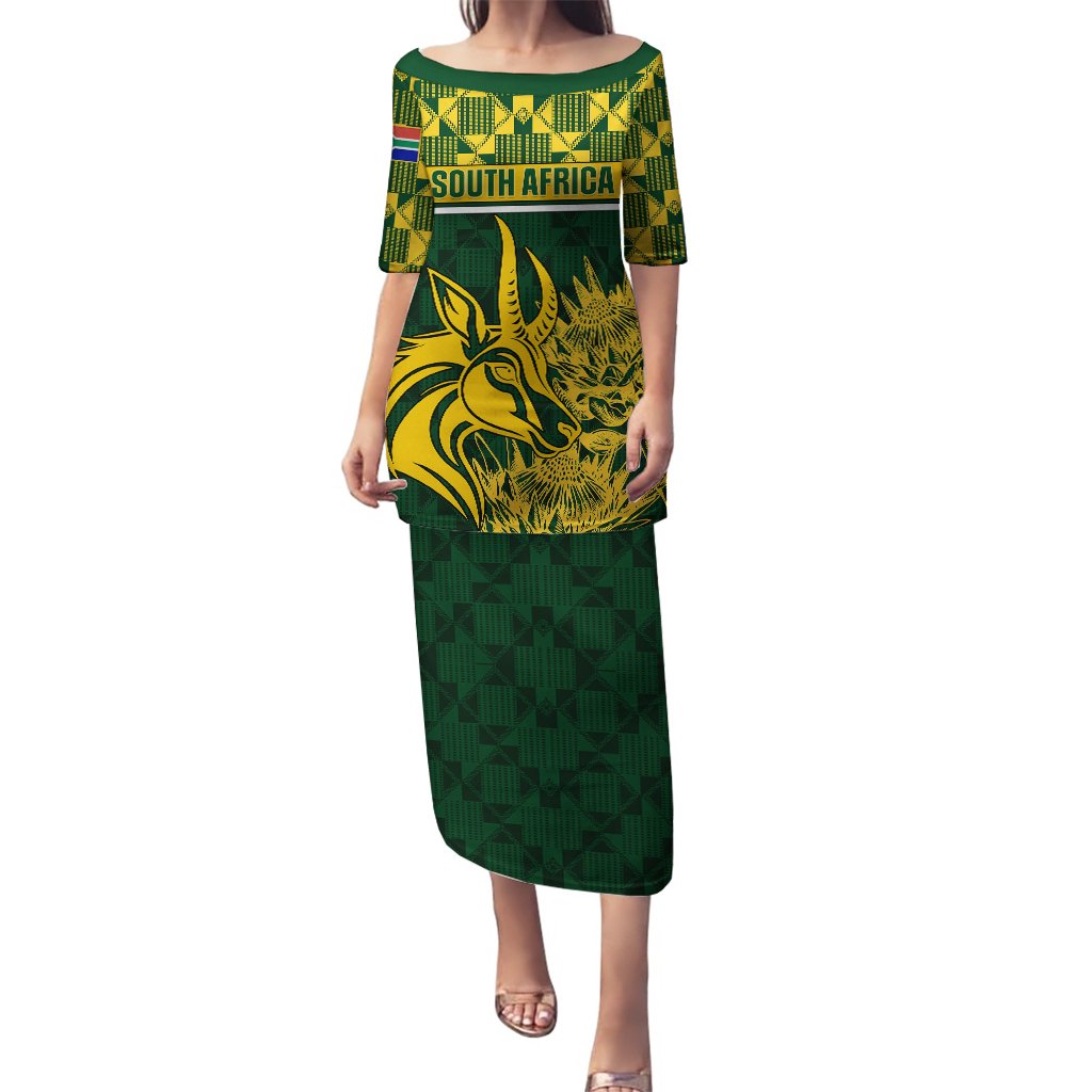 Green long dress with round neck, short sleeves, gold South Africa graphic and geometric hem
