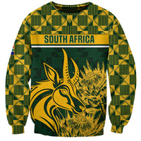 Green rugby sweatshirt with yellow check pattern and South Africa graphic on chest