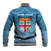 Blue unisex rugby-style varsity jacket back with large crest, patterned sleeves, ribbed hem