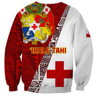 Red and gray rugby sweatshirt back with Tonga crest, 'TIKALE TAHI' text, and cross.