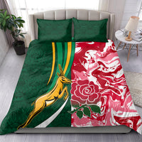Rugby bedding set on bed, green and red crest-and-floral duvet with matching pillowcases