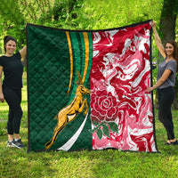 Green and red rugby quilt with gold springbok and white stripes, floral design
