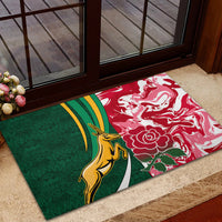 Green and red doormat with gold kangaroo, rose motif, and rugby stripe banner