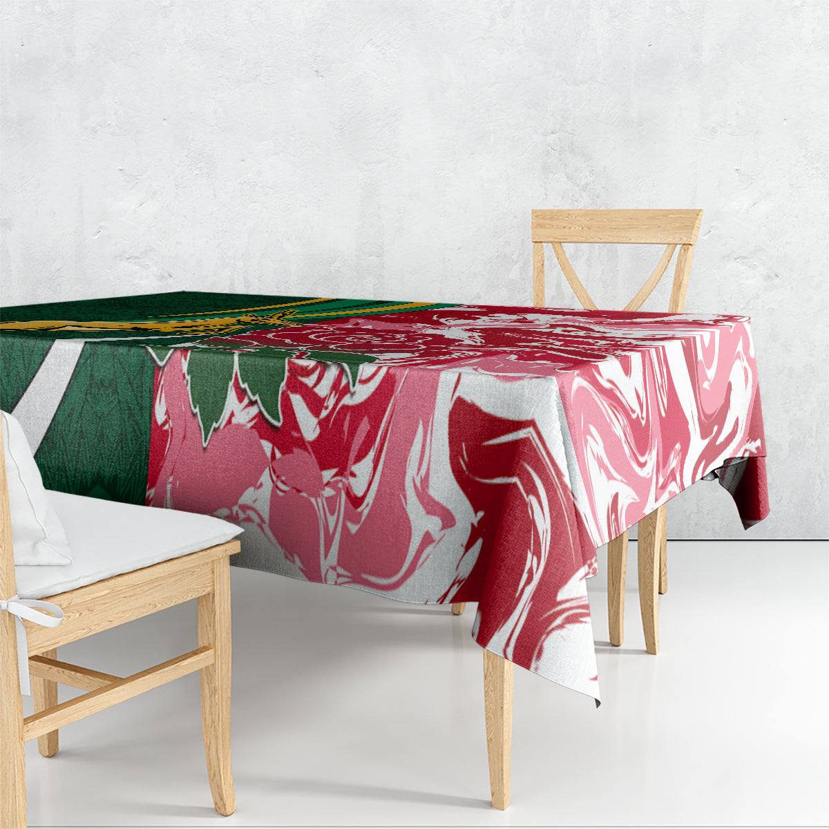 Tablecloth draped on table with bold green and red swirl pattern and white accents