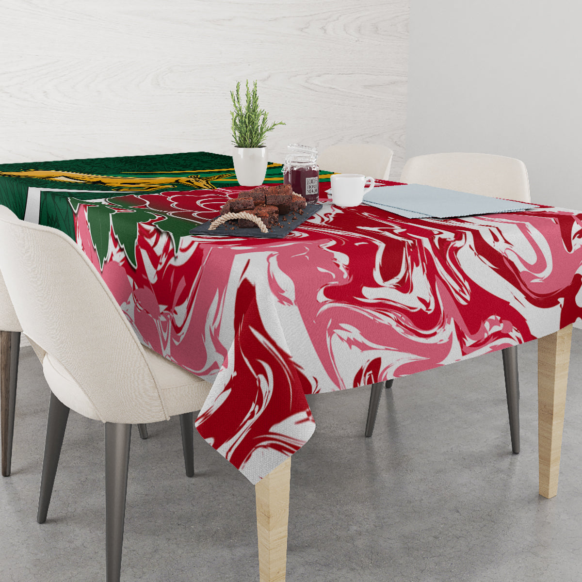 Tablecloth over dining table in red and white swirl pattern with green panel