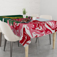 Tablecloth over dining table in red and white swirl pattern with green panel