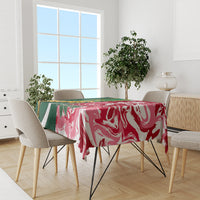 Rectangular tablecloth on dining set with red and white swirl pattern, green edge panel