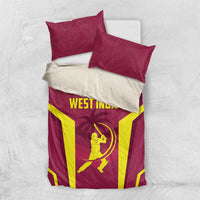 Maroon bedding set laid flat with two pillows showing West Indies logo and cricket graphic