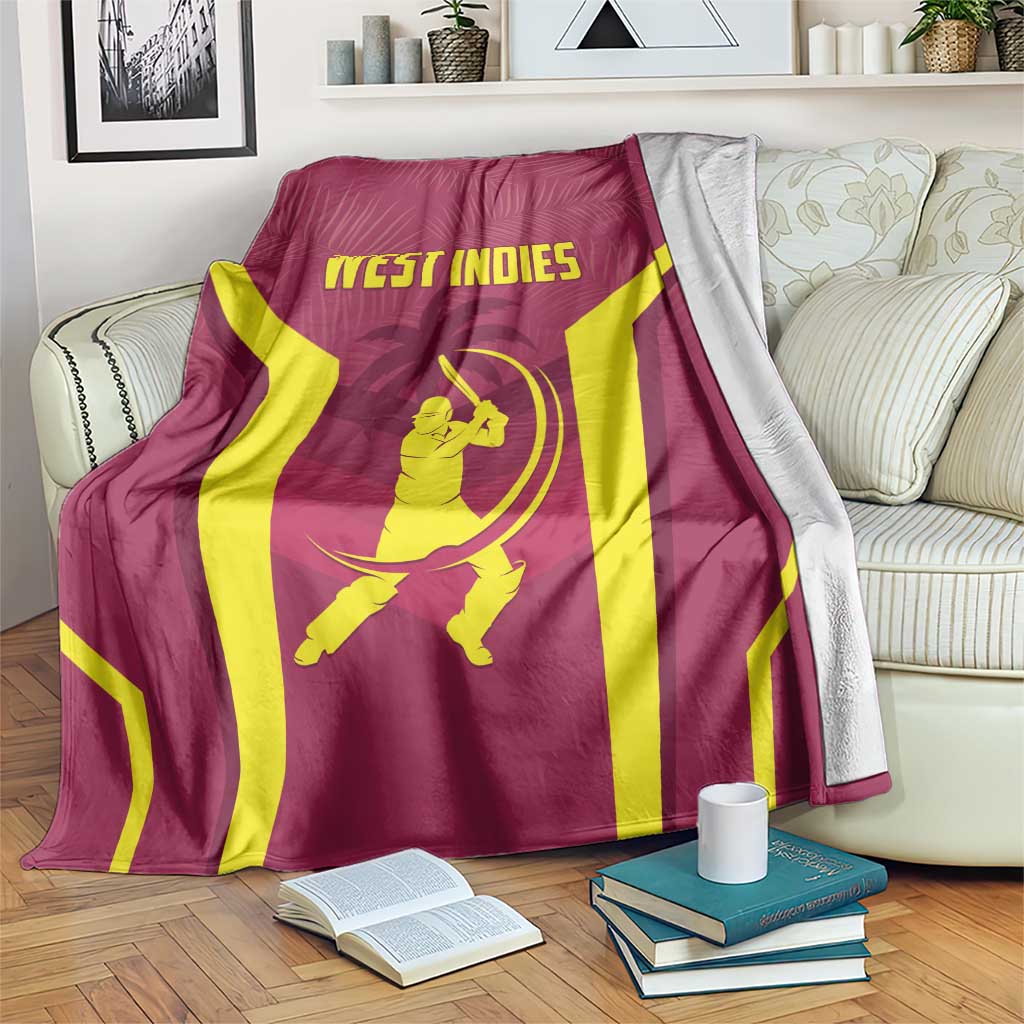 Maroon cricket blanket with yellow stripes and WEST INDIES logo, draped on couch