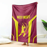 Maroon cricket blanket with yellow V stripes and batter graphic, draped upright