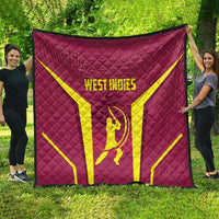 Red West Indies cricket quilt with yellow X and WEST INDIES logo, spread outdoors