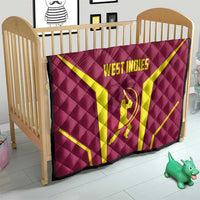 Red West Indies cricket quilt on crib mattress with yellow X and WEST INDIES logo
