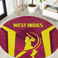 Round West Indies cricket rug with maroon base, yellow text, and batter graphic