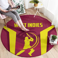Round West Indies cricket rug, maroon circle with yellow WEST INDIES letters and batter