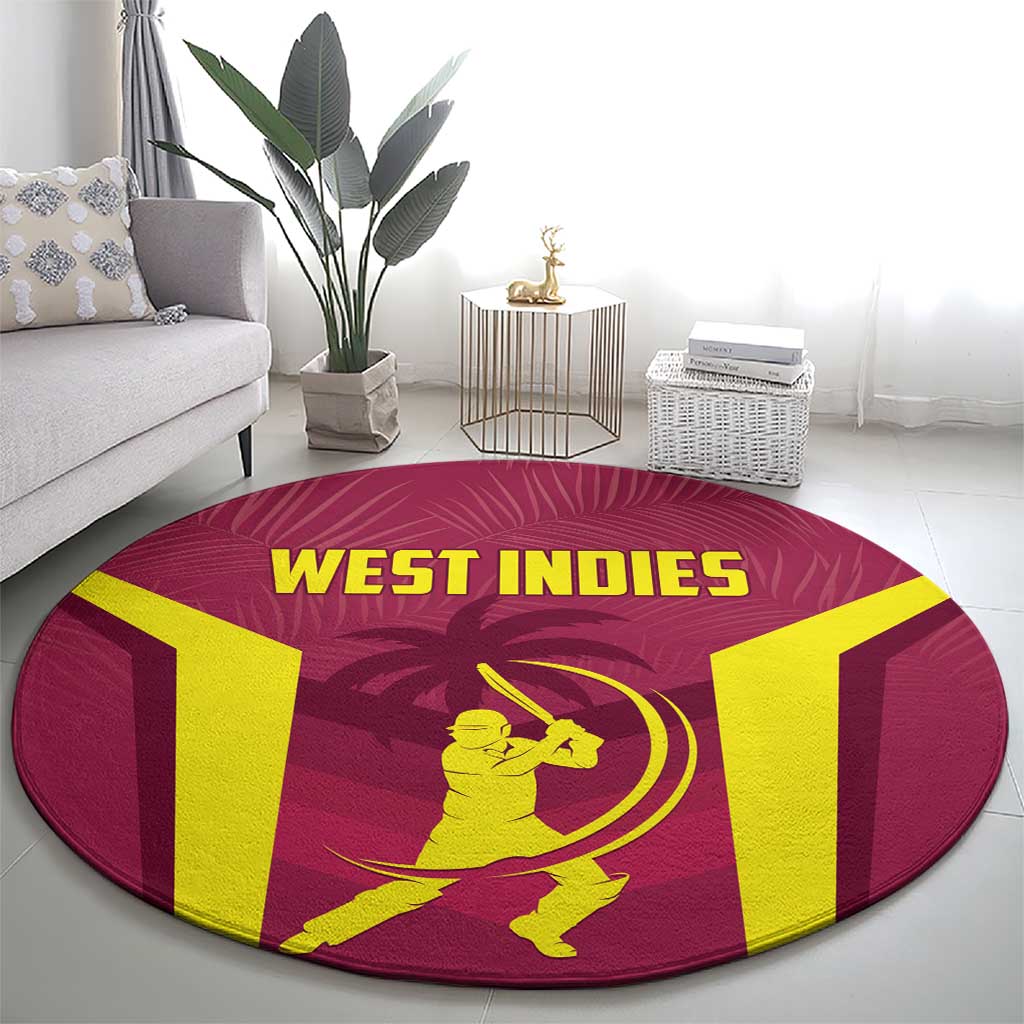 Round West Indies cricket rug on floor, maroon with yellow WEST INDIES lettering and player