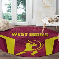 Round West Indies cricket rug corner view, maroon with yellow batter and WEST INDIES text