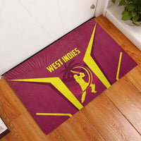 Red West Indies cricket rubber doormat, angled view, yellow logo and batsman
