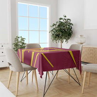 Red tablecloth draped over dining table with yellow geometric cricket pattern