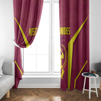 Red cricket window curtains with yellow rays pattern and emblem, hung beside glass door