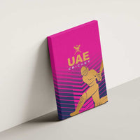 Pink UAE Cricket canvas wall art mounted on wall with gold logo and stripes