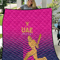 Pink UAE Cricket quilt with quilted pattern and gold cricket player graphic