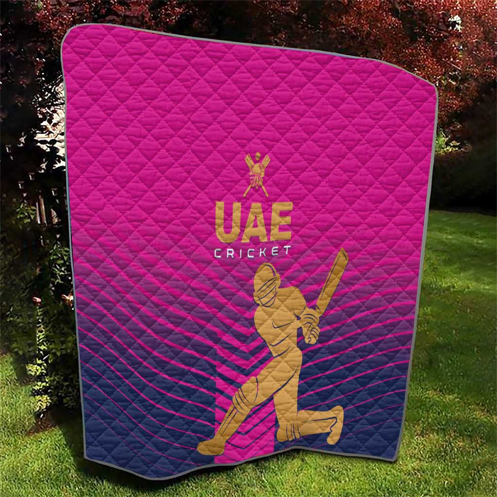 Pink UAE Cricket quilt with diamond stitching, gold crest, and seated batsman graphic