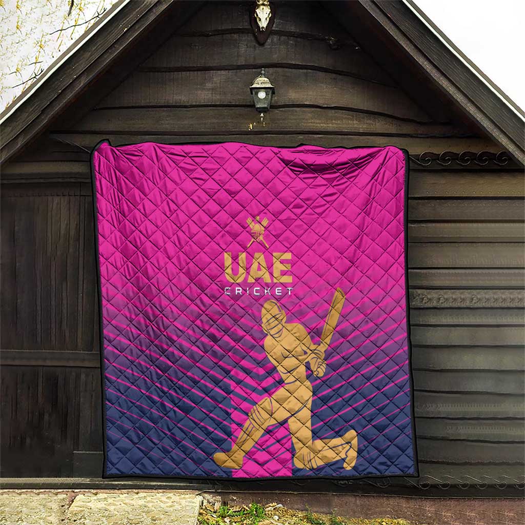 Pink UAE Cricket quilt hung on wall with gold “UAE CRICKET” logo and player art
