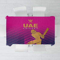 Pink UAE cricket tablecloth with gold batsman and UAE Cricket logo on striped design