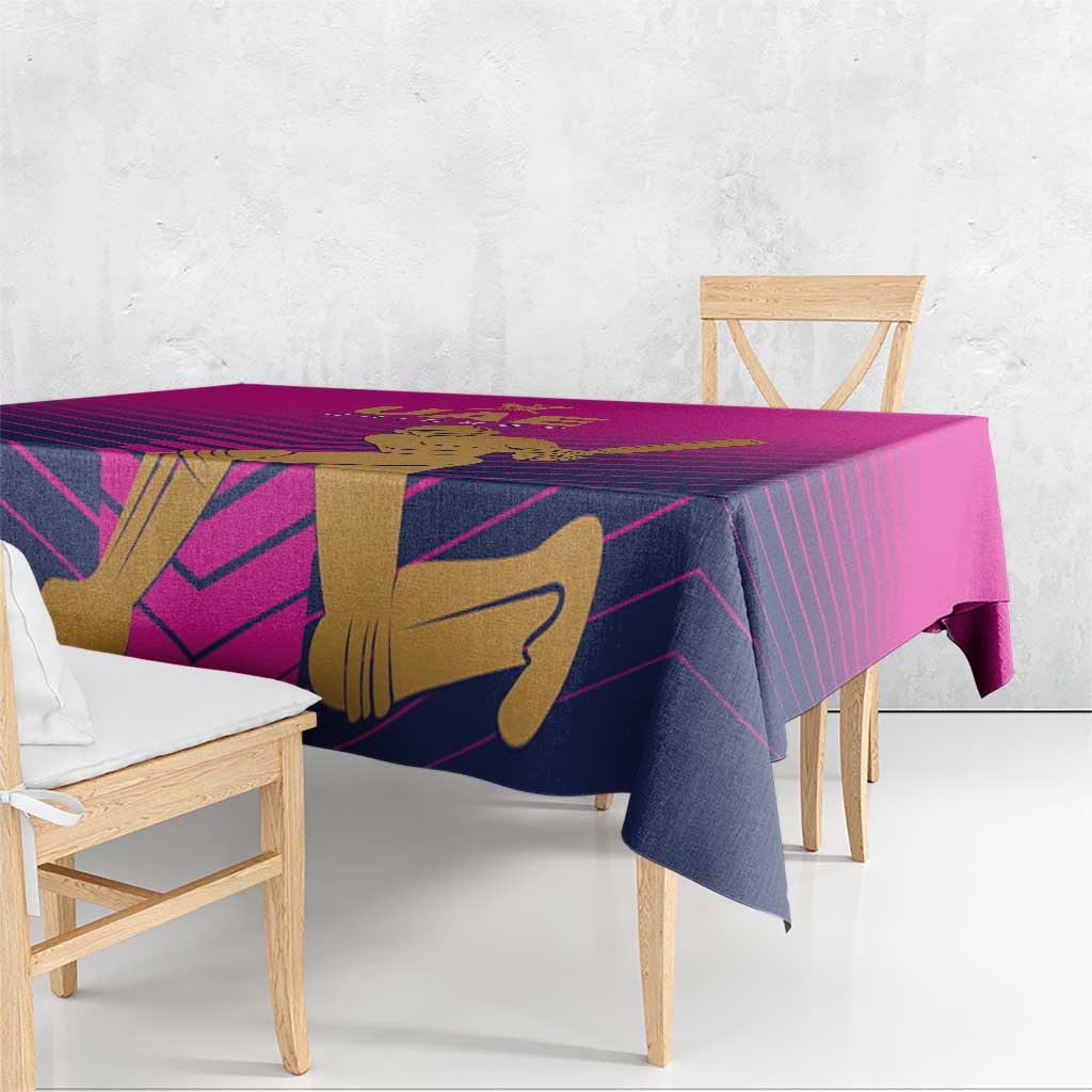 Pink UAE cricket tablecloth on bench edge, showing gold batsman and striped pattern